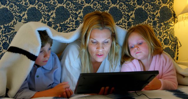 Mother Reading Digital Tablet Story to Children Before Bedtime - Download Free Stock Images Pikwizard.com