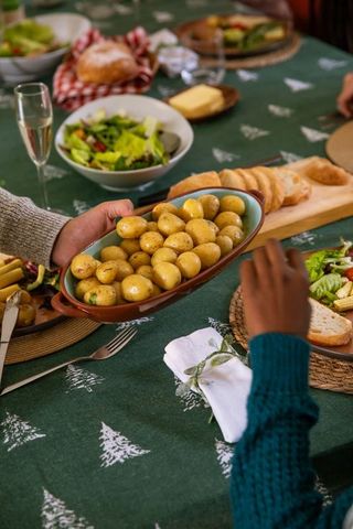 Cozy Holiday Gathering with Fresh Cuisine at Dining Table