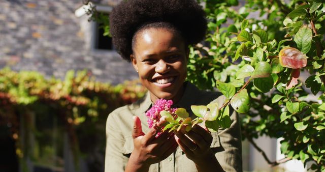 Joyful African American Woman Enjoying Sunny Garden Day - Download Free Stock Images Pikwizard.com