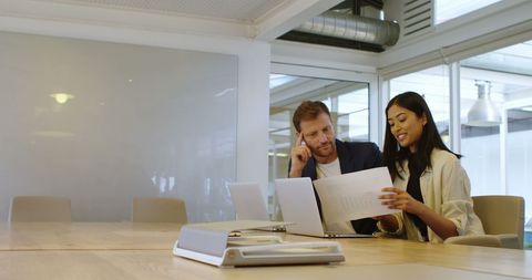 Business Colleagues Collaborating on Office Documents - Download Free Stock Images Pikwizard.com