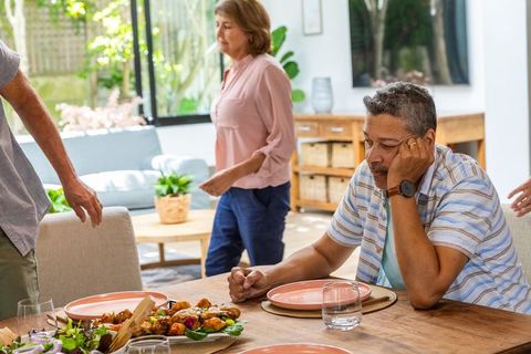 Diverse family gathering at home with rustic dining space