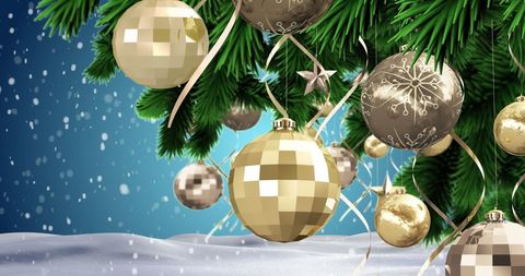 Elegant Gold Baubles and Snow on Christmas Tree