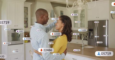 Couple Embracing in Modern Kitchen with Social Media Notifications