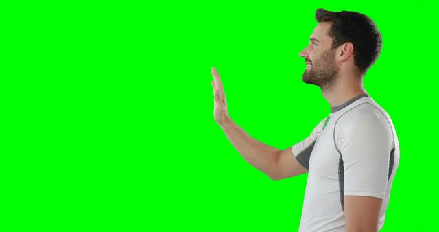 Man Waving and Smiling in White Athletic Wear on Green Screen - Download Free Stock Images Pikwizard.com