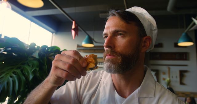 Chef Tasting Freshly Baked Pastry in Artisan Bakery - Download Free Stock Images Pikwizard.com