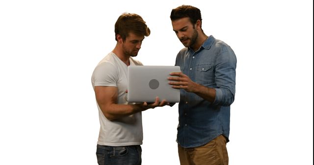 Two Young Men Collaborating on Laptop - Download Free Stock Images Pikwizard.com