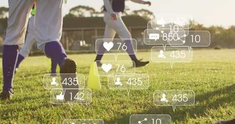 Athletes Training on Grass with Digital Engagement Icons Overlay