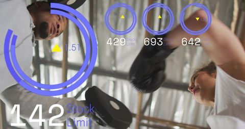 Trainer and trainee hitting focus mitts with augmented hud overlays boxing drill in gym