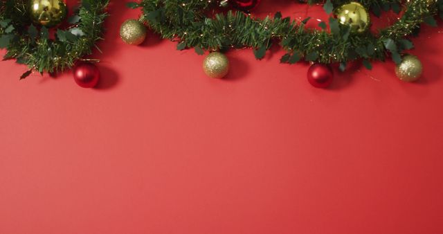 Christmas decorations with baubles and copy space on red background. christmas, tradition and celebration concept image.