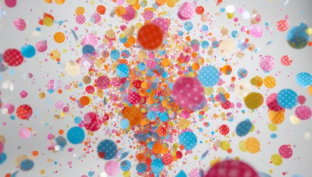Bursting colorful polka-dot confetti scattering vibrant circular bokeh and glossy depth