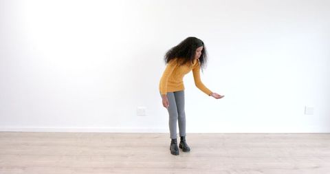 Woman Gestures in Spacious Modern Interior