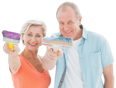 Happy senior couple holding paintbrushes on white background