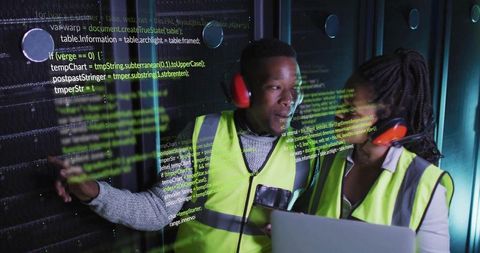 Technicians Collaborating in Data Center with Code Overlay