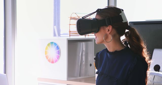 Professional Woman Exploring Virtual Reality in Modern Office - Download Free Stock Photos Pikwizard.com
