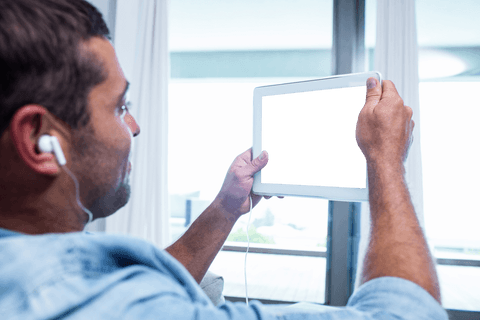 Man Holding Digital Tablet Against Large Window with Transparent Reflection - Download Free Stock Videos Pikwizard.com