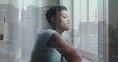 Contemplative Woman Overlooking Urban Cityscape