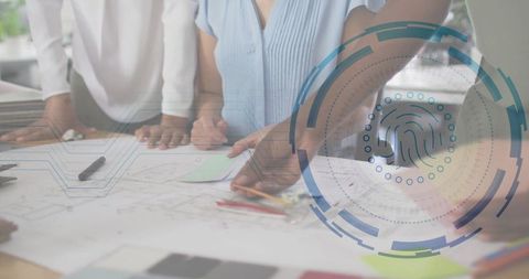 Collaborating Women Analyzing Architecture Blueprints with Biometric Overlay