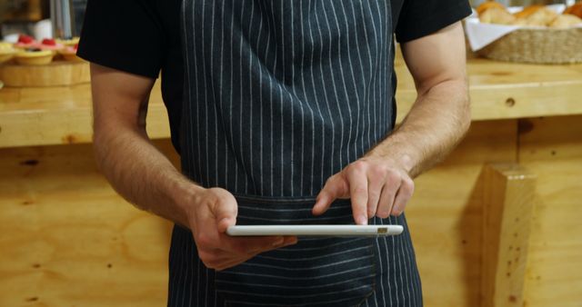 Barista Using Tablet for Orders in Coffee Shop - Download Free Stock Images Pikwizard.com