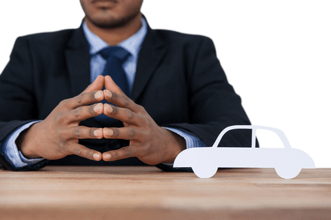 Transparent Businessman With Car Model on Desk