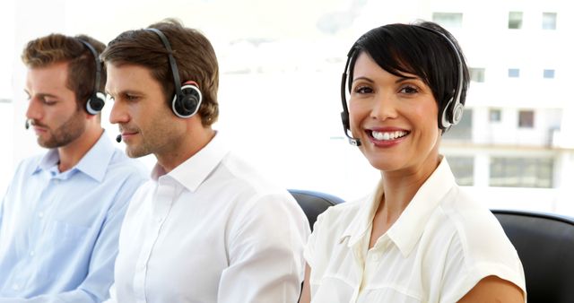 Customer Service Representatives with Headsets Smiling - Download Free Stock Images Pikwizard.com