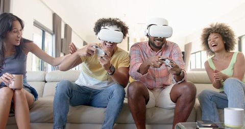Diverse Friends Playing VR Video Games and Enjoying Hangout