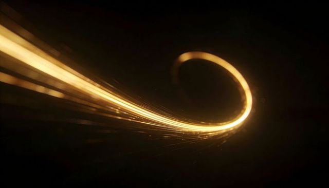 Glowing golden light trail loop sweeping across dark void with spark particles