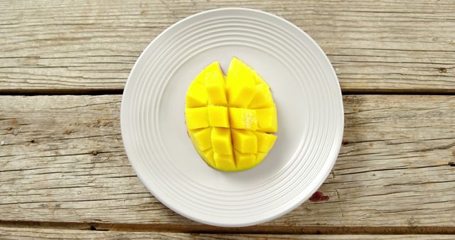 Sliced Mango on White Plate, Rustic Wood Background - Download Free Stock Images Pikwizard.com