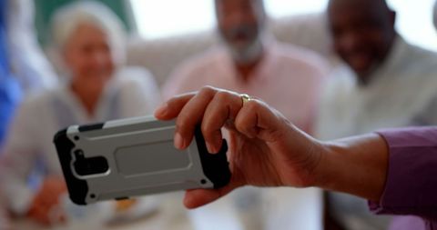 Senior Citizens Capturing Selfie at Care Facility Gathering