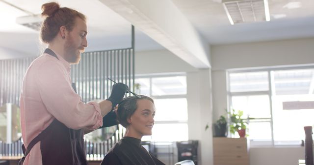 Hairstylist Applying Hair Dye to Smiling Woman in Modern Salon - Download Free Stock Images Pikwizard.com