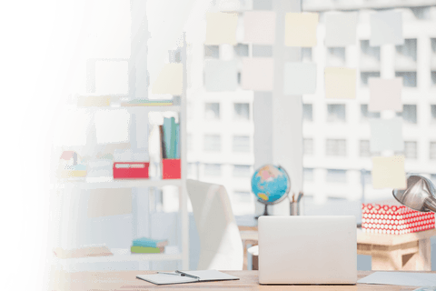Organized desk with laptop and supplies on transparent background