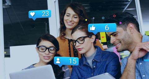 Team collaborating and monitoring real-time social media engagement on devices