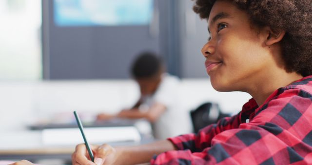 African American Boy Smiling While Learning in Classroom - Download Free Stock Images Pikwizard.com