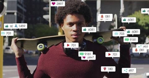 Skateboarder holding board behind neck wearing headphones with social media notifications