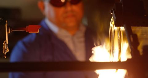 Glassmaker Crafting Molten Glass in Industrial Workshop - Download Free Stock Images Pikwizard.com