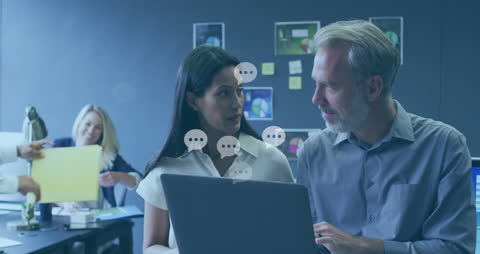 Diverse Business Team Engaging with Digital Data Icons in Modern Office