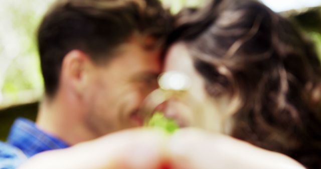 Couple Holding Engagement Ring in Blurred Close-Up - Download Free Stock Images Pikwizard.com