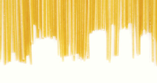 Close-Up of Dried Spaghetti Pasta Hanging on White Background - Download Free Stock Images Pikwizard.com