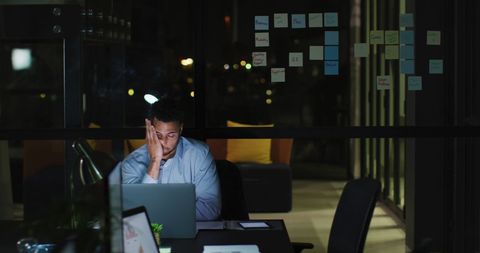 Exhausted Businessman Late Night Office Work Focus