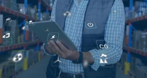 Warehouse Manager Analyzing Eco-Friendly Innovations on Tablet