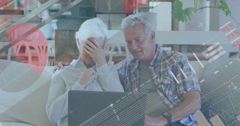 Worried Elderly Couple Analyzing financial Data on Laptop with Graphics Overlay