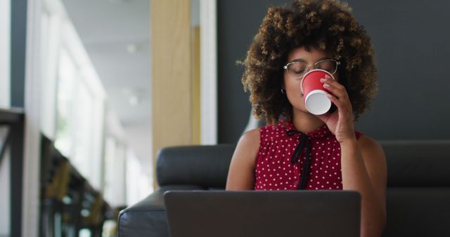 Woman Working on Laptop and Drinking Coffee in Cozy Office - Download Free Stock Images Pikwizard.com