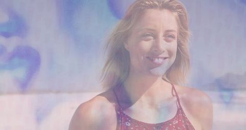 Woman Enjoying Summer Day on Beachside with Radiant Smile