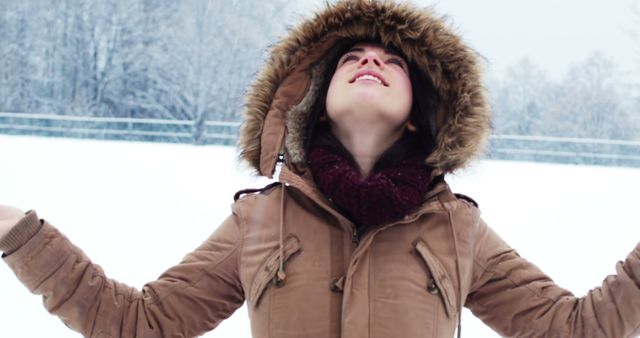 Woman Appreciating Winter Snowfall in Park - Download Free Stock Images Pikwizard.com