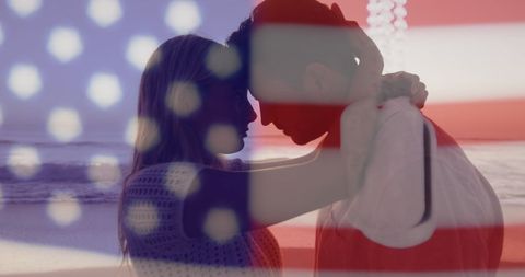 Couple Embracing on Beach with American Flag Overlay