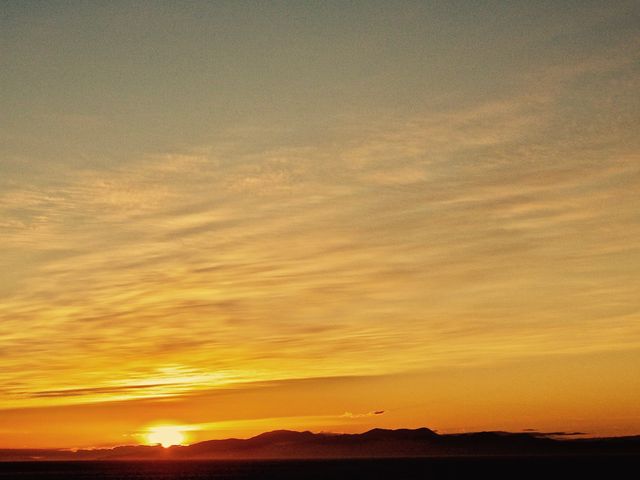Golden Sunset Over Mountain Range with Cloudy Sky - Download Free Stock Photos Pikwizard.com