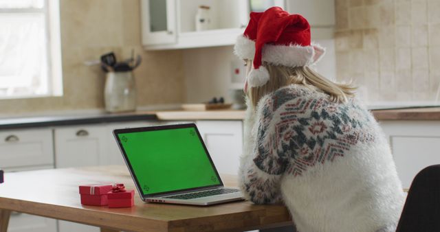 Woman Wearing Christmas Hat Using Laptop with Green Screen - Download Free Stock Images Pikwizard.com