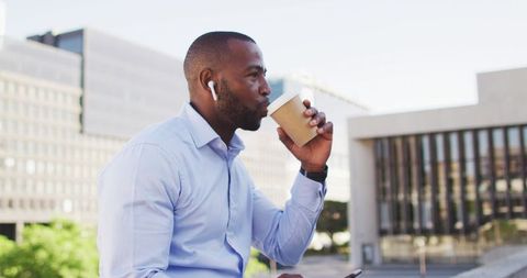 Urban Professional in Cityscape Enjoying Coffee Break - Download Free Stock Images Pikwizard.com