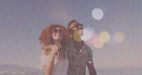 Couple Enjoying Romantic Beach Walk in Sunny Getaway