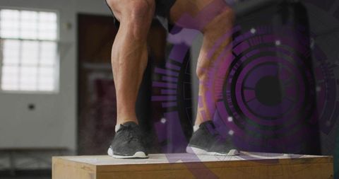 Explosive plyometric box jump showing powerful calves and dynamic lower-body training