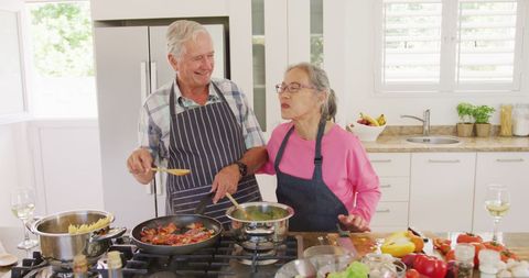 Senior Couples Enjoy Cooking in Modern Kitchen Together - Download Free Stock Images Pikwizard.com